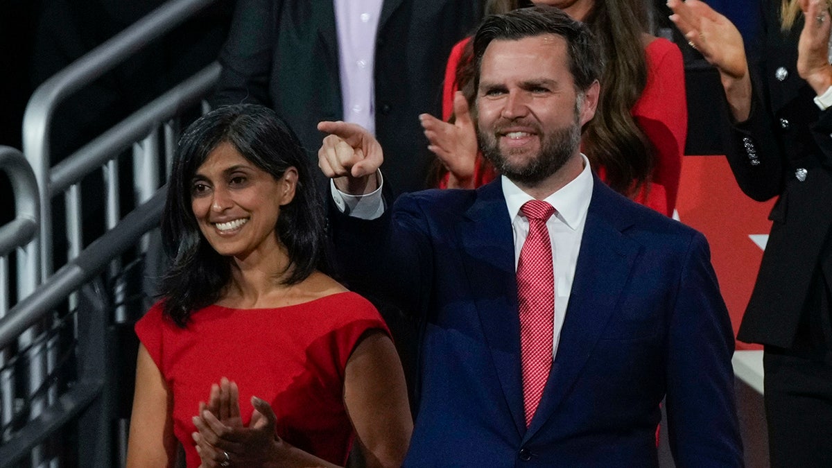 Republican vice presidential candidate Sen. JD Vance, R-Ohio, gestures to Republican presidential candidate former President Donald Trum