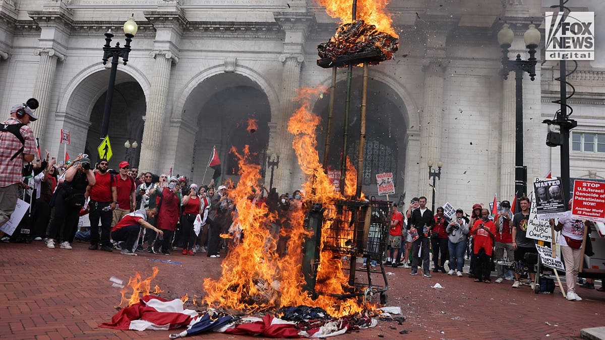 Netanyahu effigy burns above American flag, also on fire