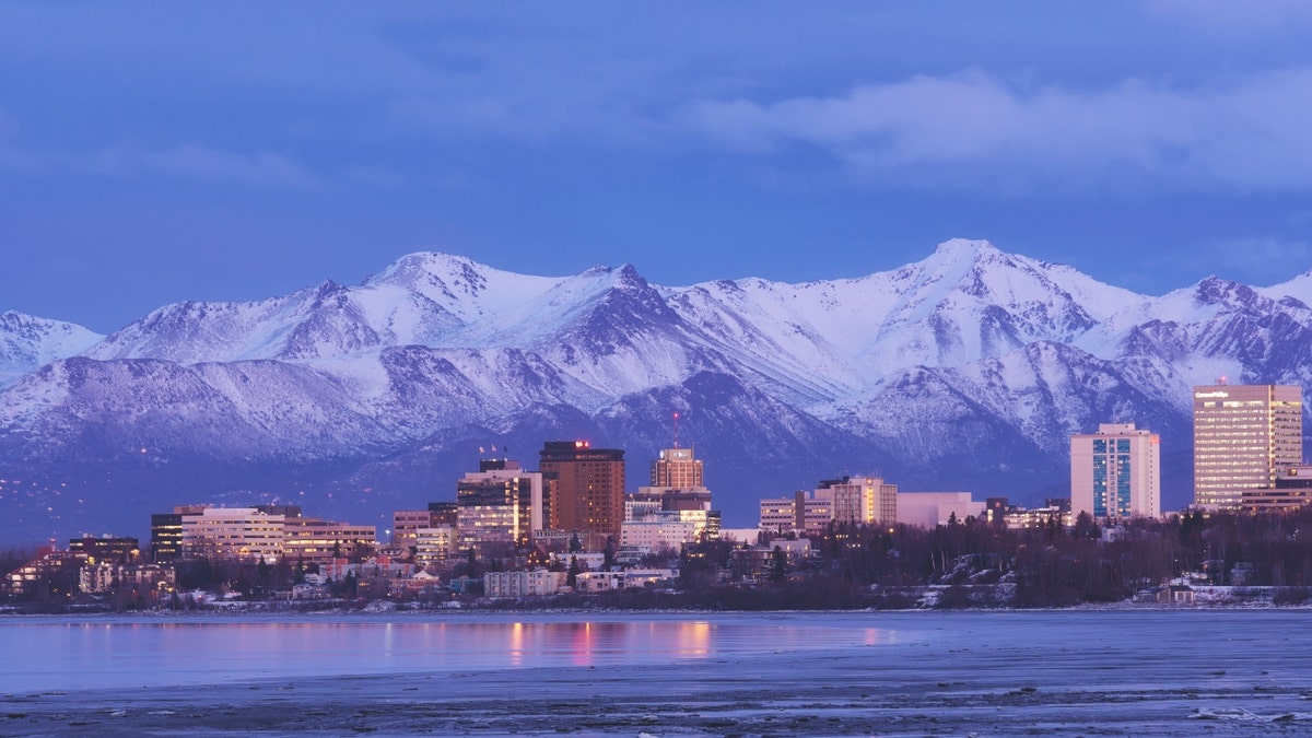 Anchorage's skyline is seen against the Chugach Range