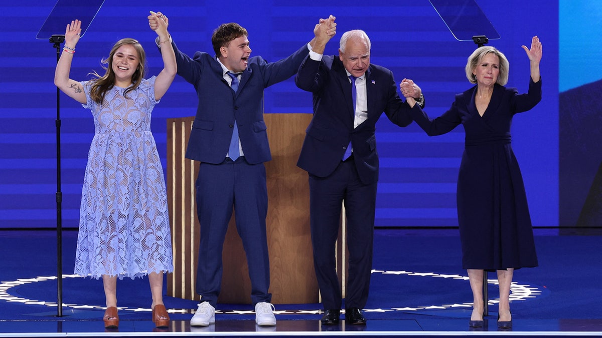 Gov. Tim Walz, D-Minn., with wife and children on DNC stage