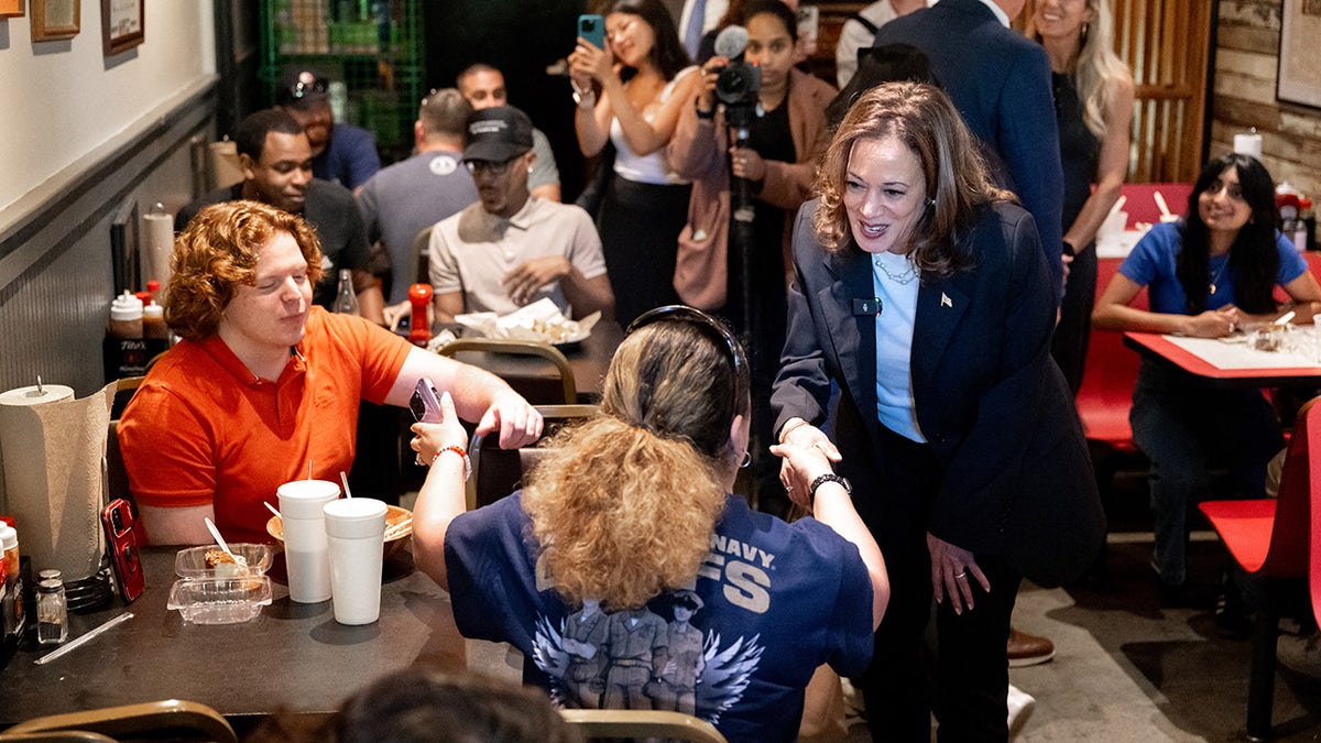 Harris shakes hands with supporters