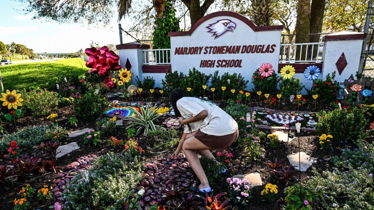 Parkland shooting memorial by school sign