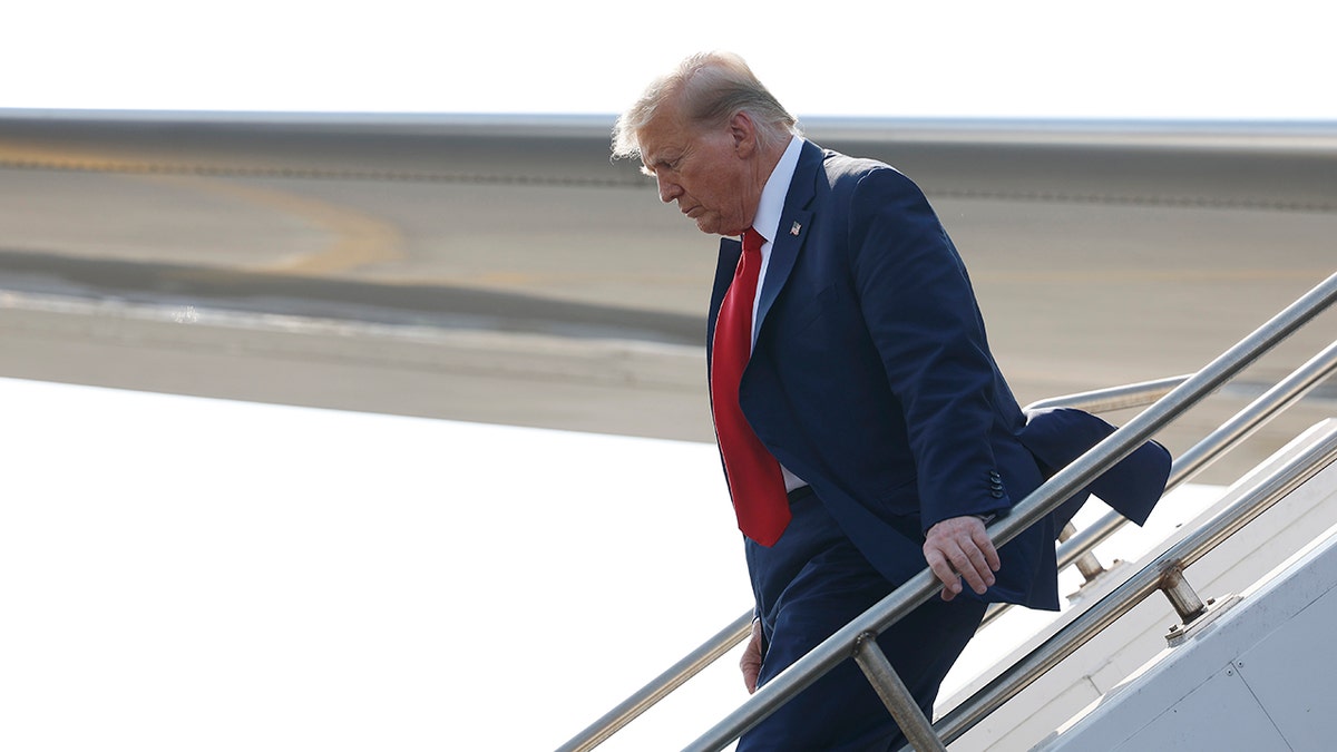 Trump exiting plane