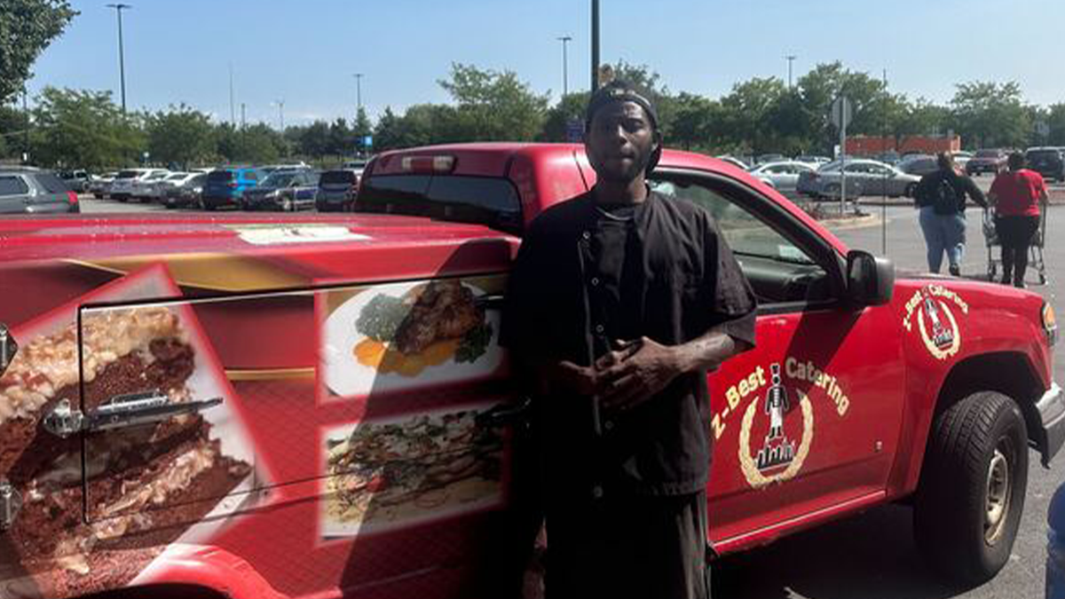 Chicago business owner standing by his truck in parking lot