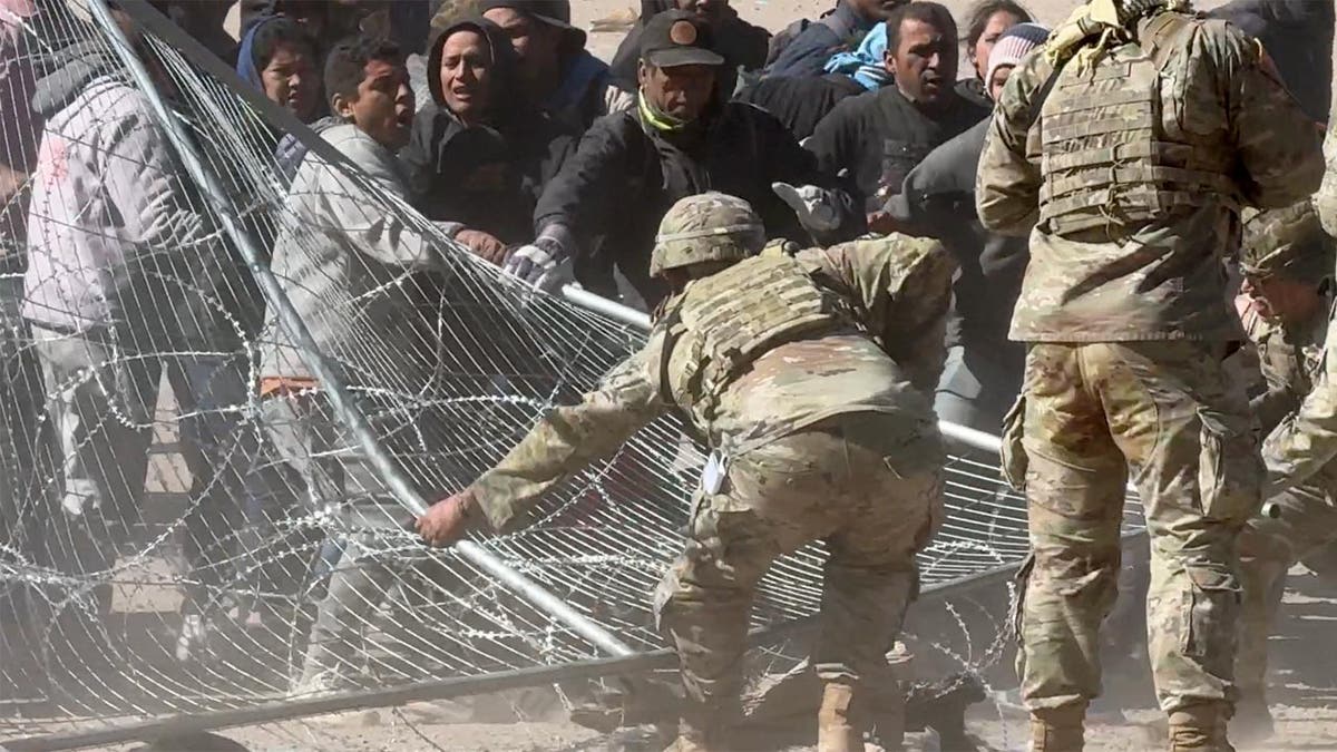 Migrants storm the gate at the border in El Paso