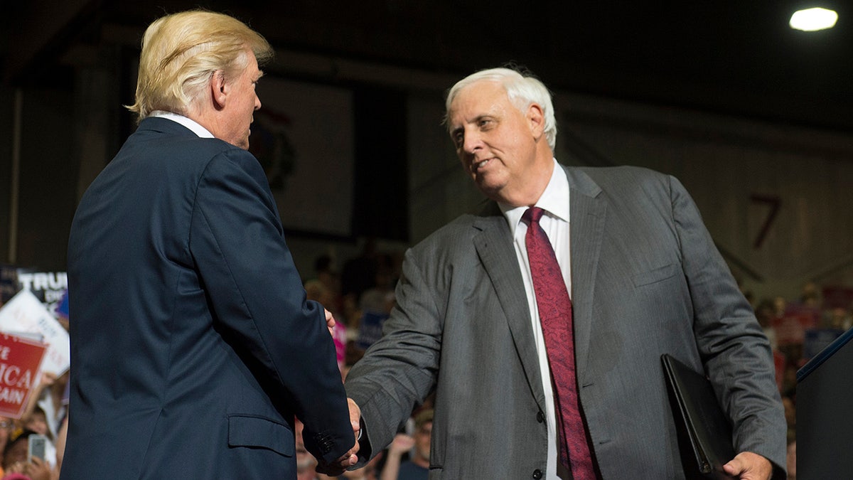 Trump and Jim Justice shake hands