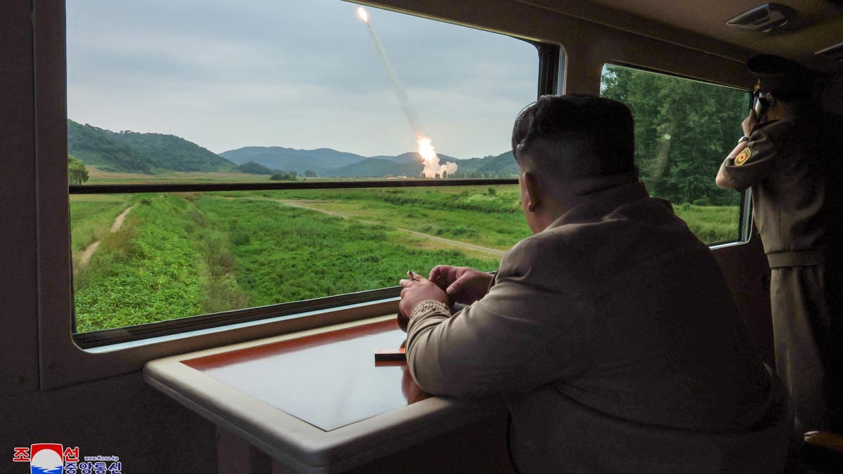 North Korean leader Kim Jong Un oversees a test-fire for a new 600mm multiple rocket launcher at an undisclosed location in North Korea, in this photo released by North Korea's official Korean Central News Agency, September 13, 2024.   