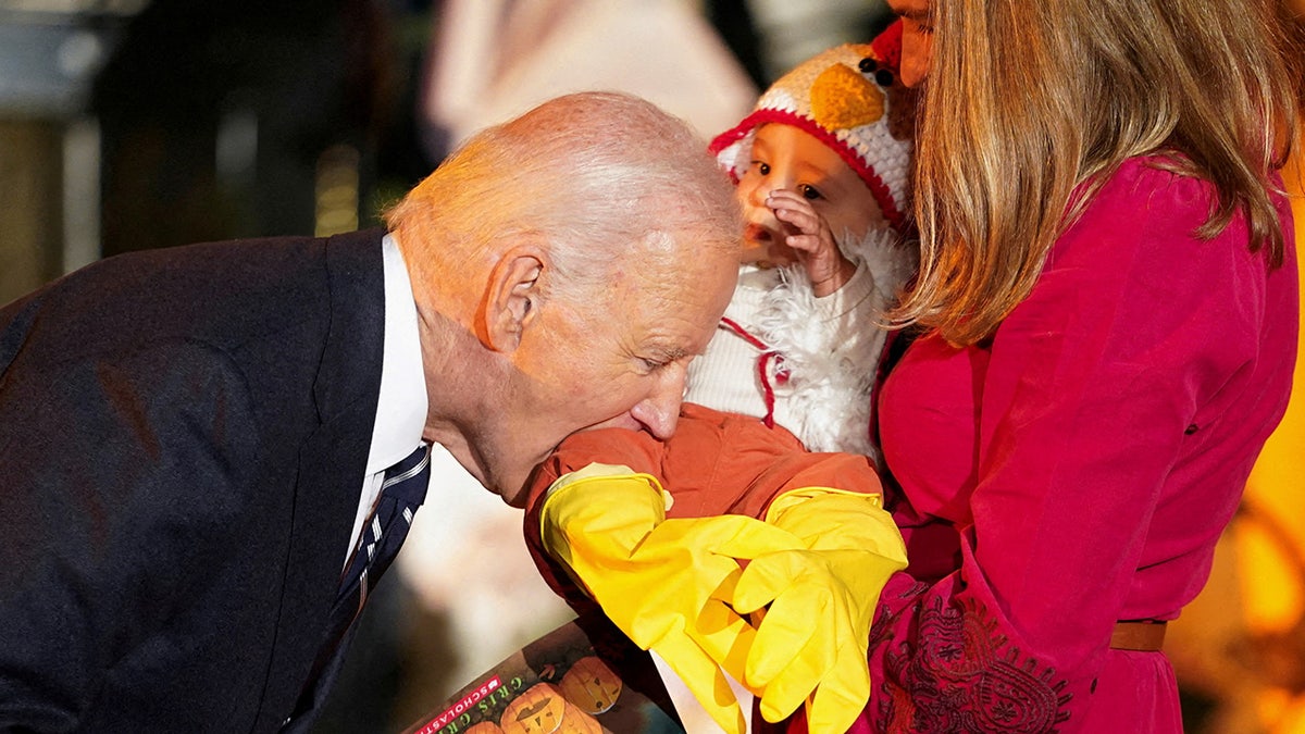 Joe Biden bites baby in chicken costume