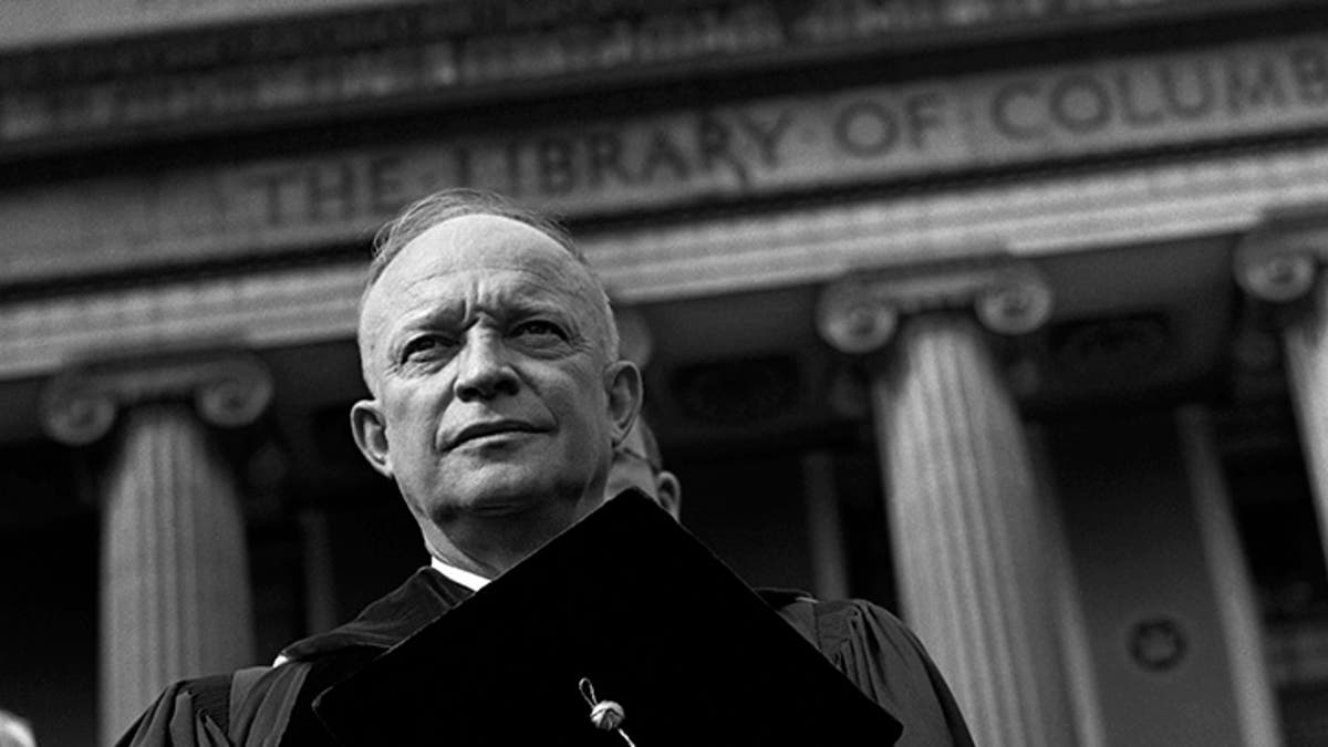 Dwight D. Eisenhower poses for a portrait in his cap and gown before his Inauguration to become President of Columbia University