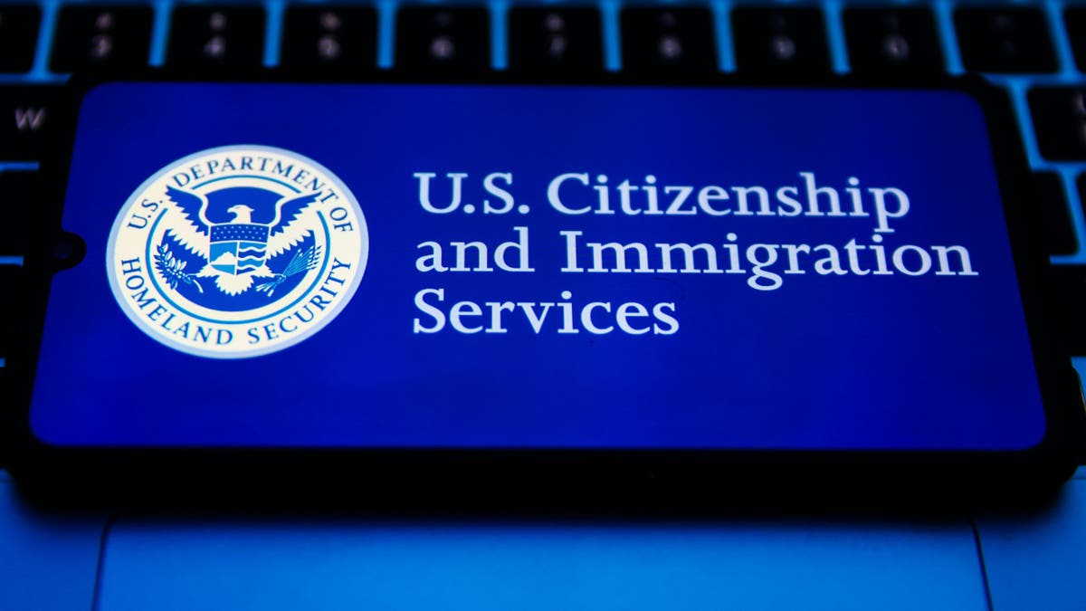 USCIS on a phone screen