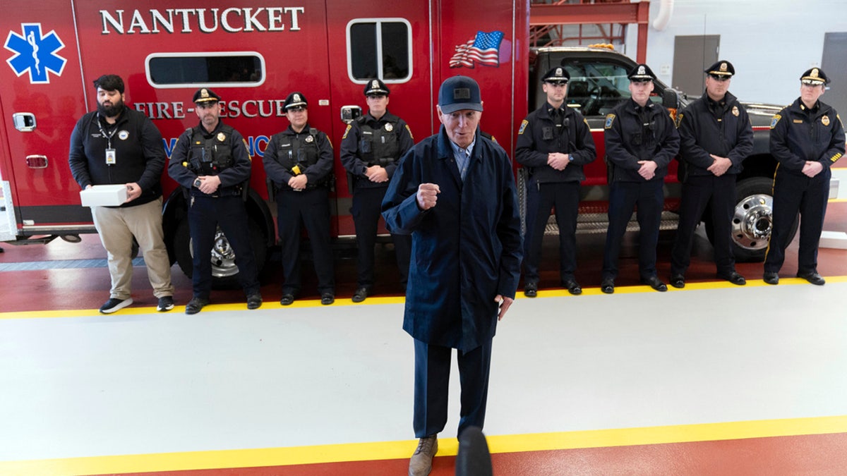 President Biden in front of fire truck and officers