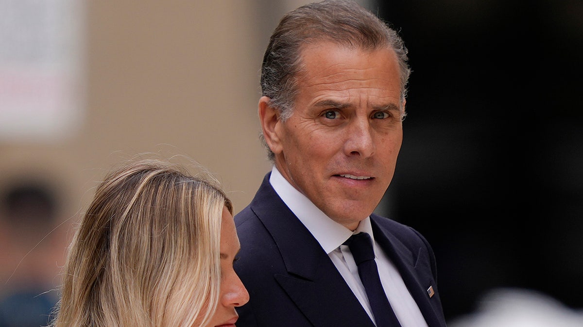 Hunter Biden with wife Melissa outside court