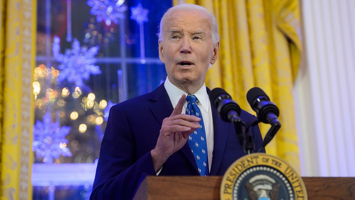 Biden speaking at the podium.