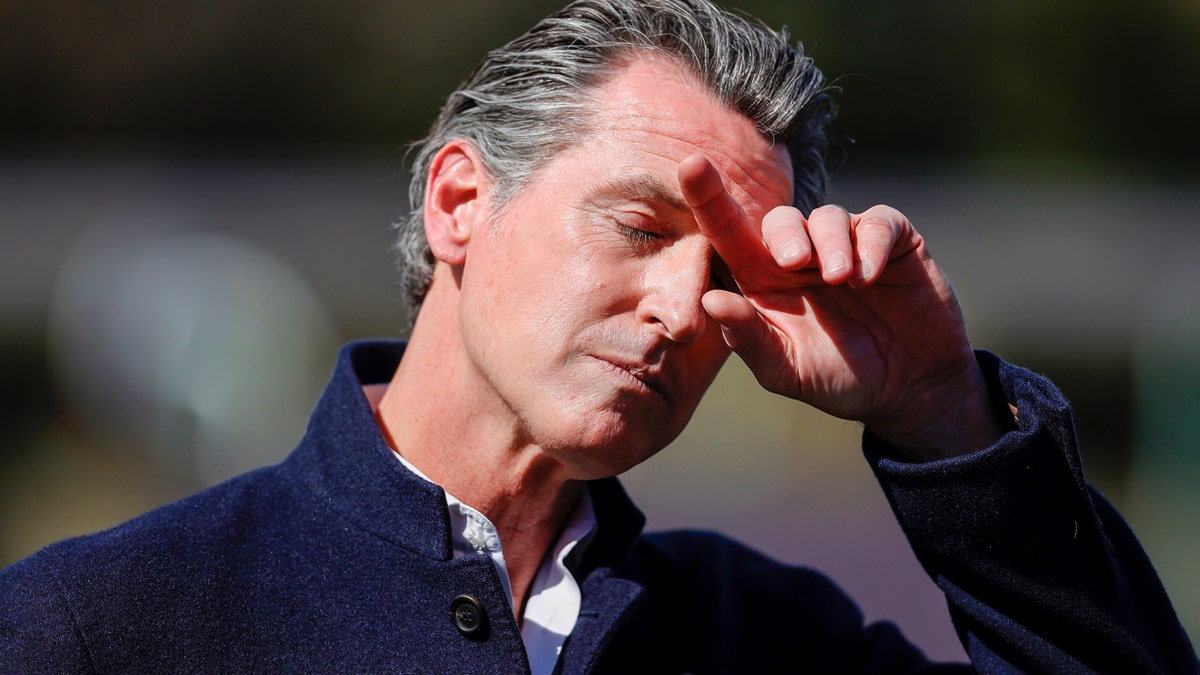 California Gov. Gavin Newsom pauses during a news conference.