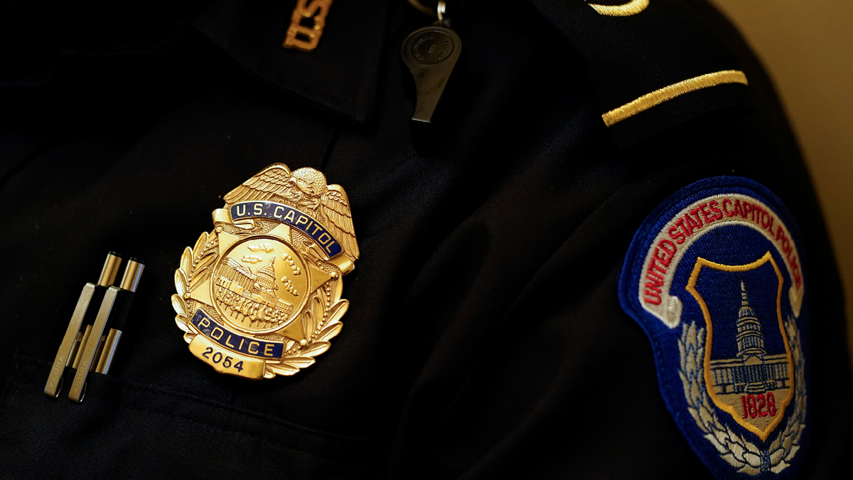 closeup on U.S. Capitol Police badge on uniform