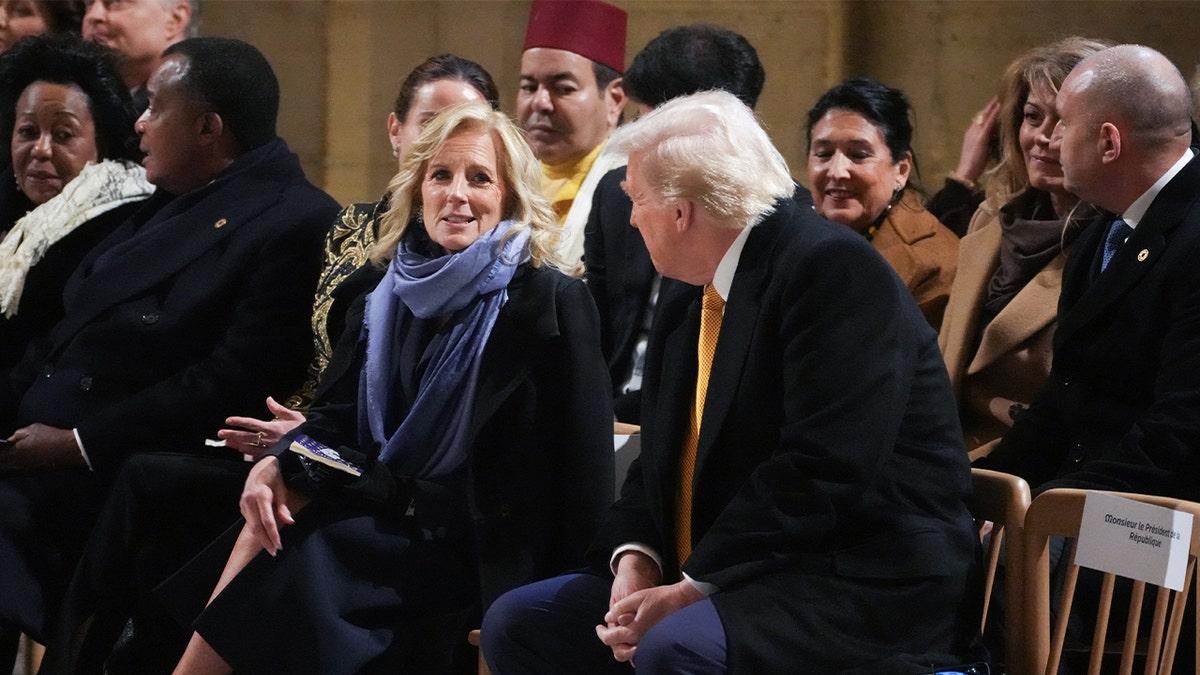 First Lady Jill Biden (CL) speaks with President-elect Donald Trump during a ceremony to mark the re-opening of the landmark Notre Dame Cathedral in central Paris on December 7, 2024. 