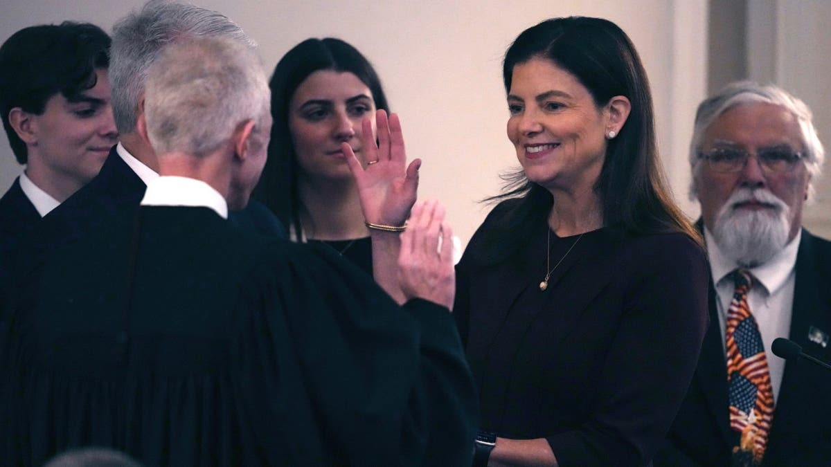 New Hampshire Gov. Kelly Ayotte takes the oath of office in Concord.