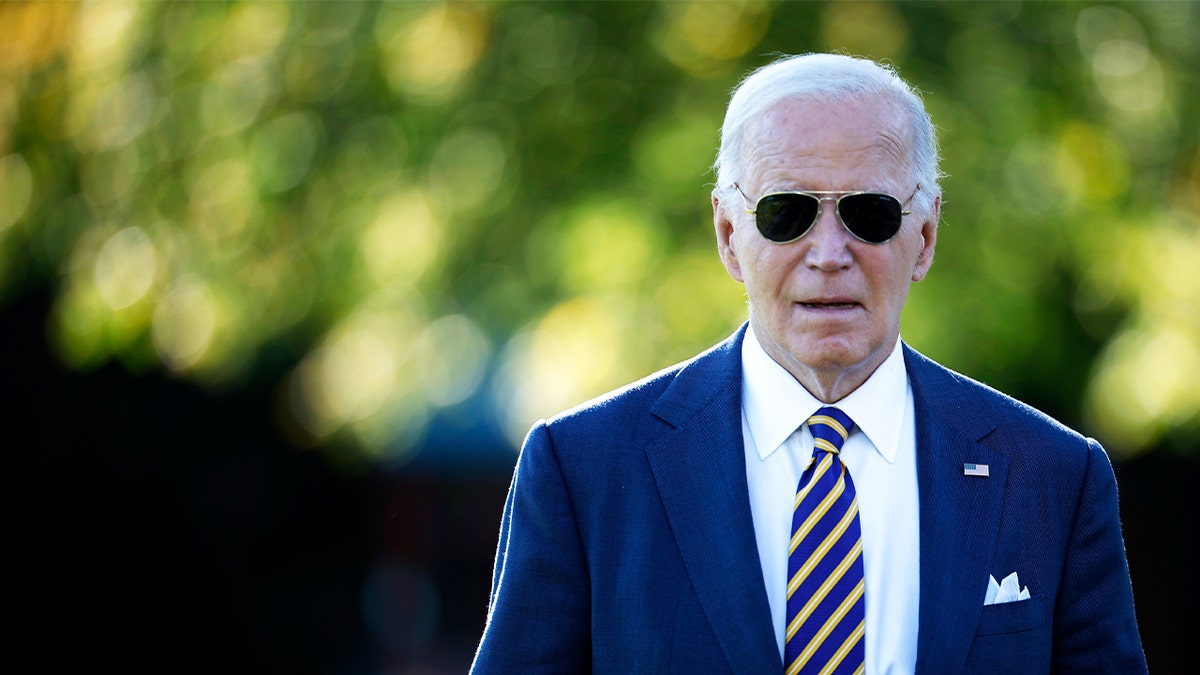 Joe Biden outdoors wearing sunglasses