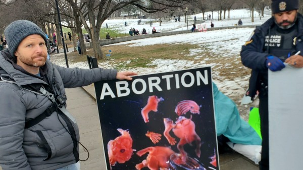 Pro-Life activist Seth Drayer was accosted by anti-fascists and other pro-abortion protesters. (Lana Shadwick/Breitbart Texas)