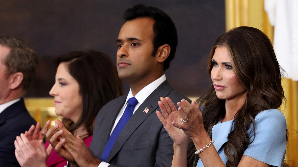 Vivek Ramaswamy and Kristi Noem applaud during U.S. President Donald Trump's presidential inauguration