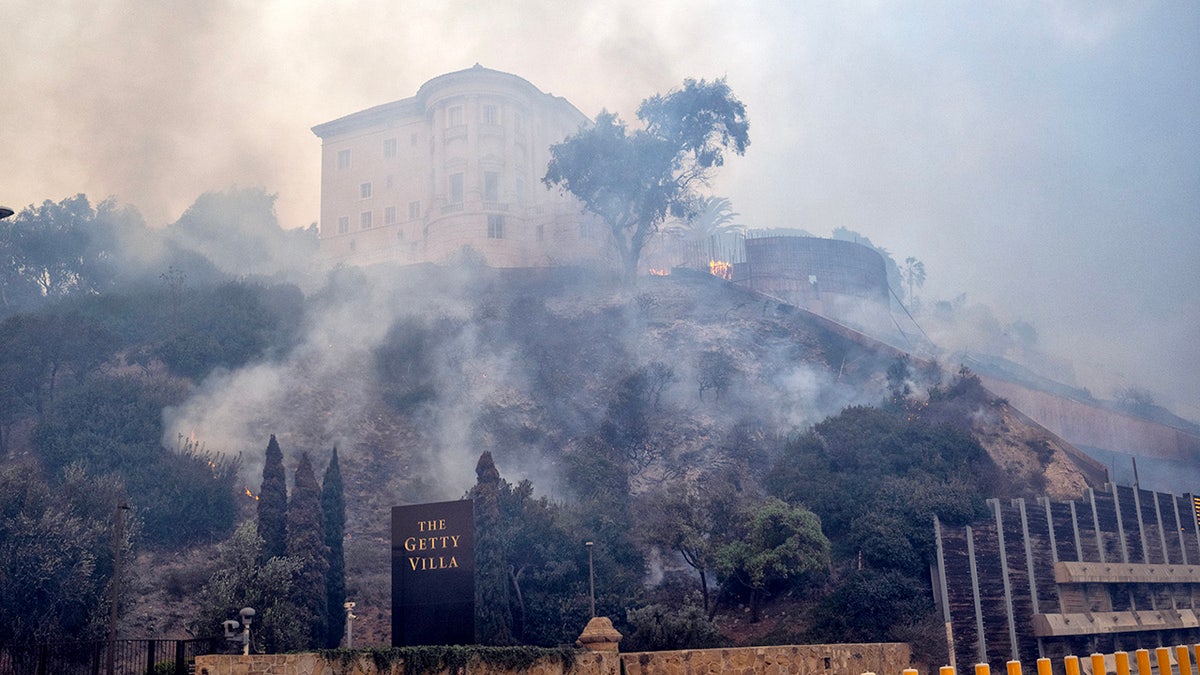 smoke from Palisades fire, hillside mansion