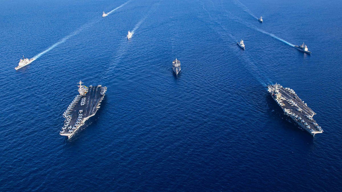 An aerial view of aircraft carriers of the United States Navy USS Gerald R. Ford and USS Dwight D. Eisenhower