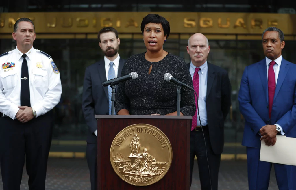 District of Columbia Mayor Muriel Bowser, joined by from left, District of Columbia Police Chief Peter Newsham, District of Columbia Council member Charles Allen, District of Columbia Council Chairman Phil Mendelson, and District of Columbia Attorney General Karl Racine, speaks at One Judiciary Square in Washington, Thursday, Oct. 5, 2017. District of Columbia officials say they won't appeal a court ruling against a strict city gun law, setting the stage for it to become easier for gun owners to get concealed carry permits in the city. City officials announced their decision not to take the case to the Supreme Court. (AP Photo/Carolyn Kaster)