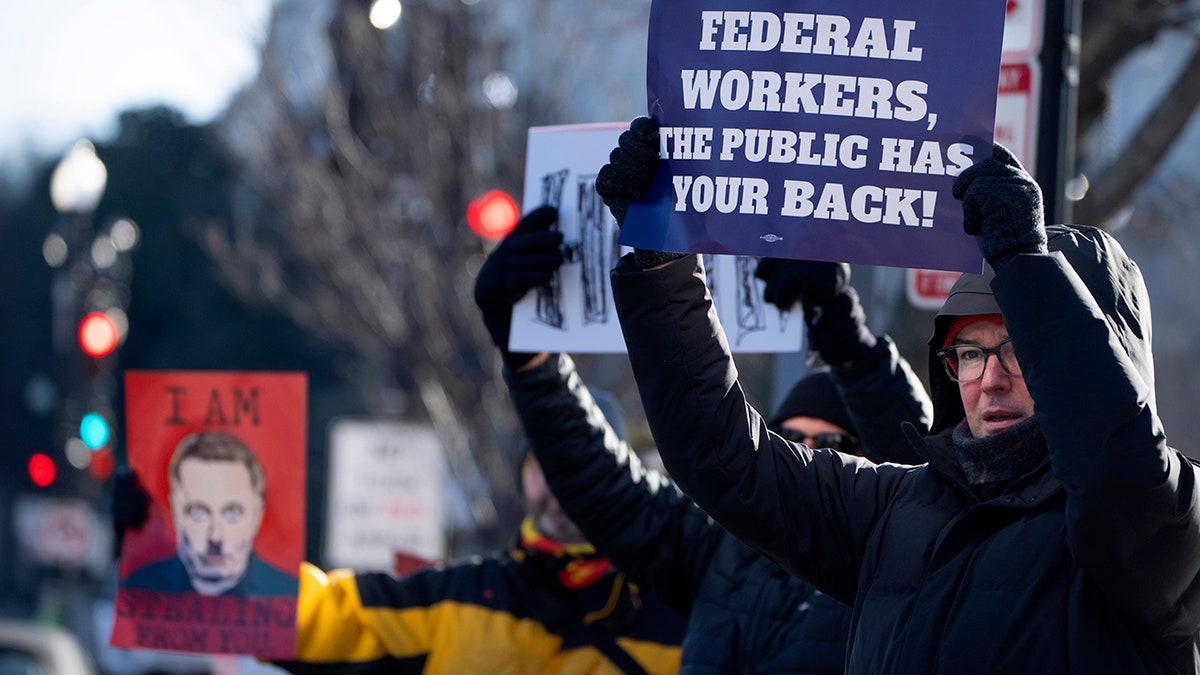 People demonstrating with signs