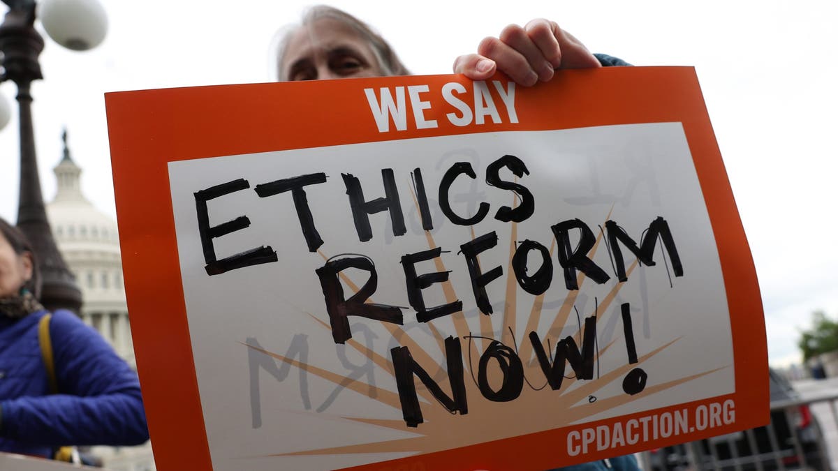 Activists attend a press conference on Supreme Court ethics reform outside the Capitol on May 2, 2023.