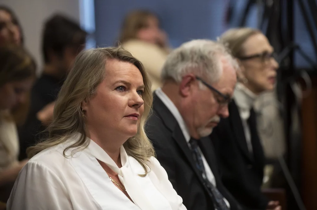 FILE - Meshawn Maddock, ex-Michigan Republican Party co-chair, listens during a preliminary exam for 16 Republican activists, of which she is one, who signed false certificates in the 2020 election attesting they were Michigan's electors and that Donald Trump won the election, at the Ingham County District Court in Lansing, Michigan, Dec. 14, 2023. (Katy Kildee/Detroit News via AP, File)