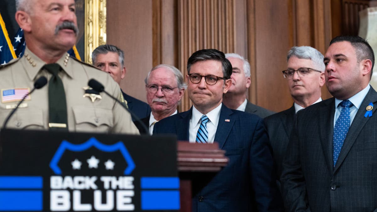 Speaker of the House Mike Johnson, R-Louisiana., center, listens to Sheriff Chad Bianco of Riverside County, Calif., speak during a news conference in the U.S. Capitol to recognize law enforcement as part of Police Week on Wednesday, May 15, 2024. (Tom Williams/CQ-Roll Call, Inc via Getty Images)