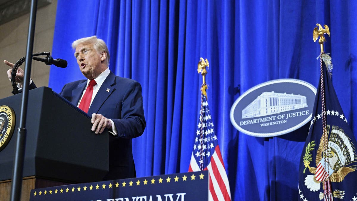 President Donald Trump speaks at the Justice Department in Washington, Friday, March 14, 2025. (Pool via AP)