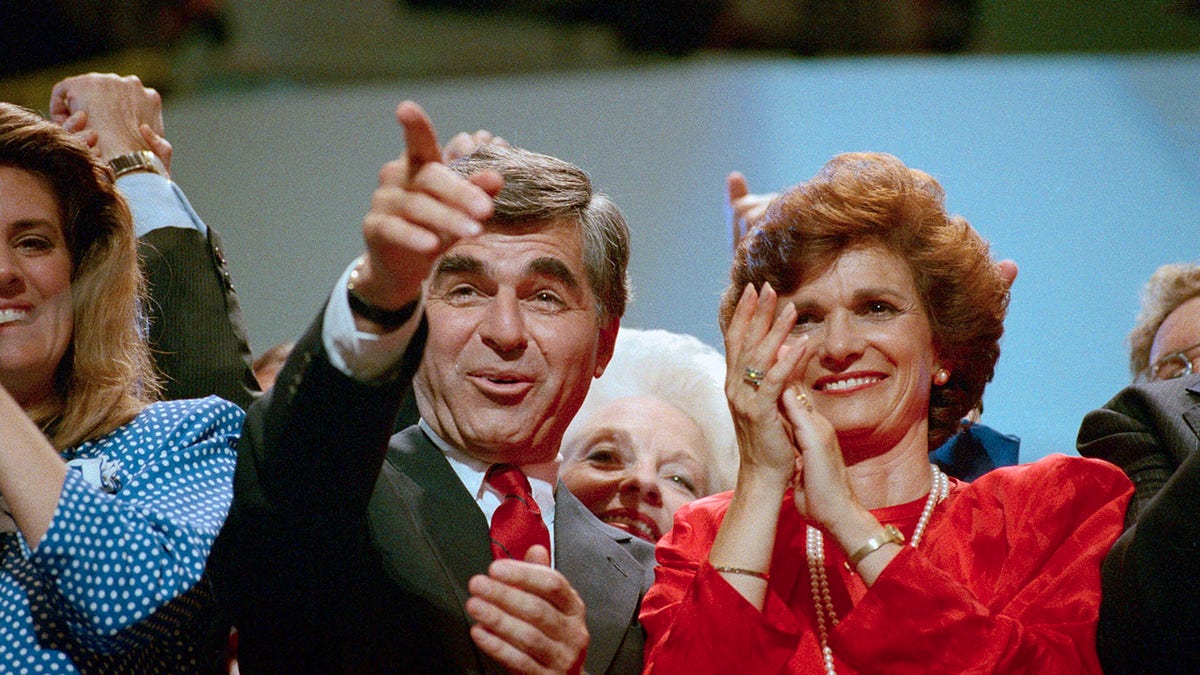 Michael and Kitty Dukakis on stage at the DNC