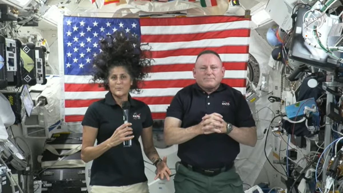 NASA astronauts Suni Williams and Butch Wilmore float inside a spacecraft