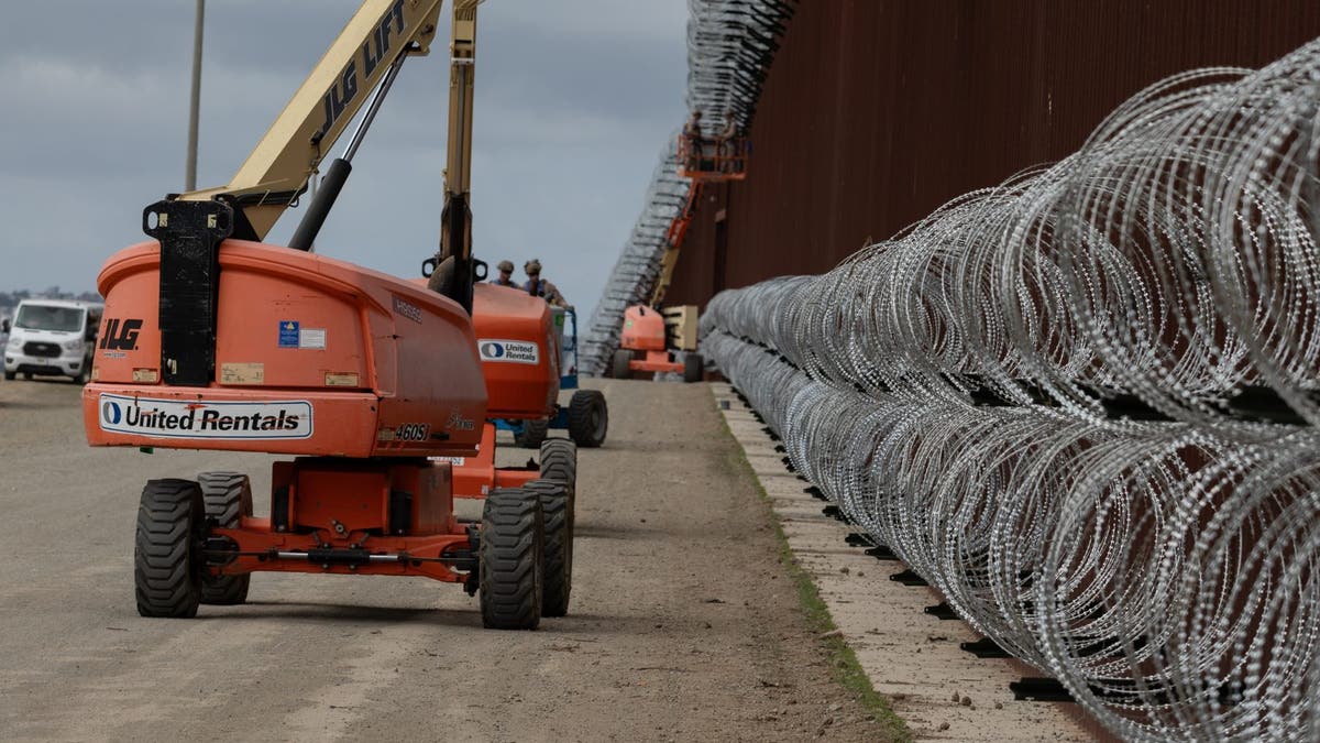 Marines installing concertina wire on border wall