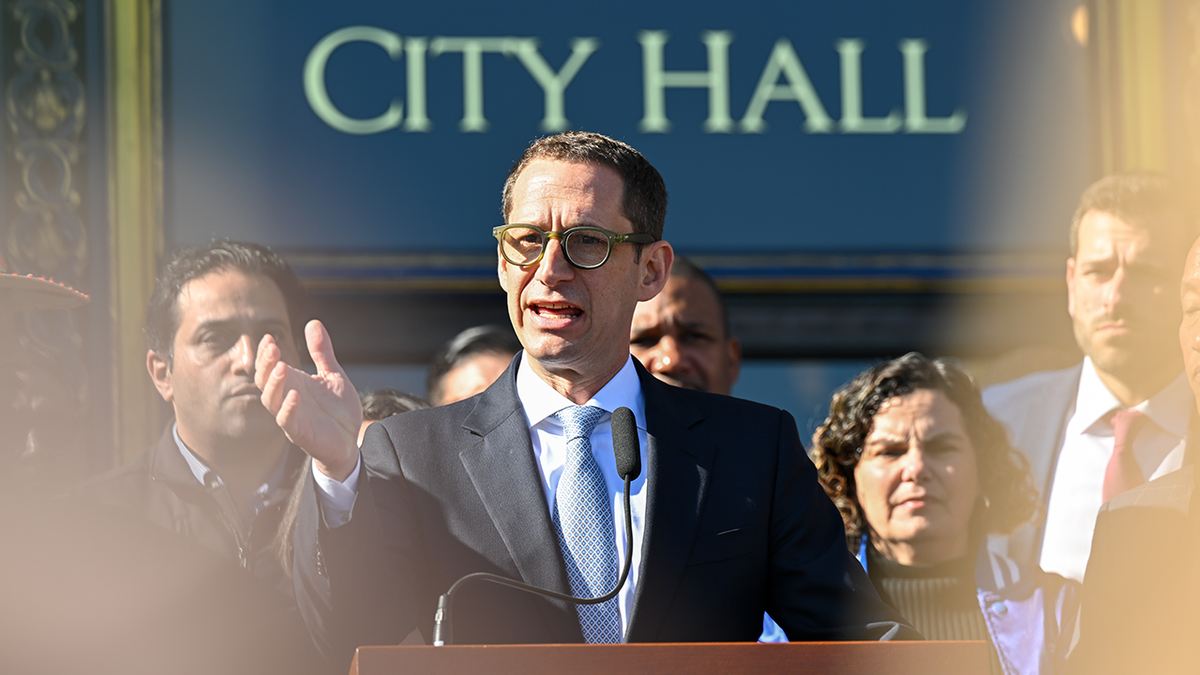 Mayor Daniel Lurie speaks on the steps of City Hall in San Francisco on Jan. 28, 2025.