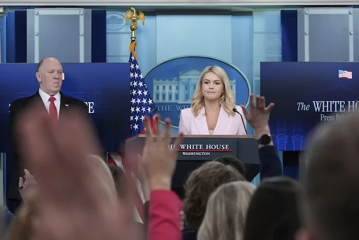 White House press secretary Karoline Leavitt, with White House border czar Tom Homan, speaks with reporters in the James Brady Press Briefing Room at the White House, Monday, April 28, 2025, in Washington. (AP Photo/Alex Brandon)
