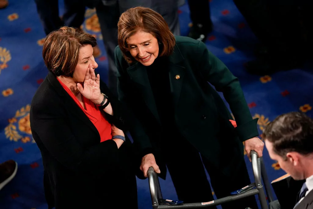 Senator Amy Klobuchar, a Democrat from Minnesota, left, speaks to Representative Nancy Pelosi, a Democrat from California, during a joint session of Congress to count the Electoral College votes of the 2024 presidential election in the House Chamber of the U.S. Capitol in Washington, D.C., on Monday, Jan. 6, 2025.