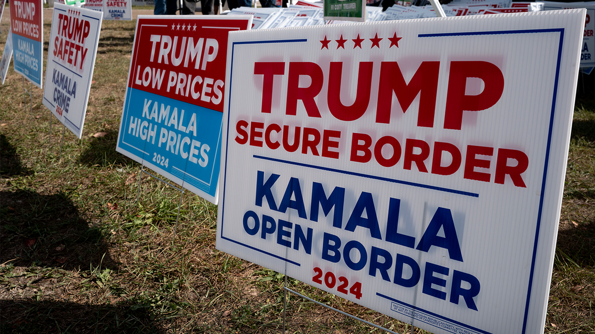 Yard signs are offered to supporters as they arrive for a campaign event with Republican vice presidential nominee U.S. Sen. JD Vance (R-OH) on Sept.25, 2024, in Traverse City, Michigan.