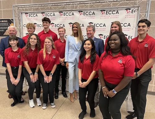 Small Business Administration Administrator Kelly Loeffler and Gov. Brian Kemp (R-GA) stand with students following a tour of the Effingham County College and Career Academy in Rincon, GA, on May 2, 2025. (Anna Giaritelli / Washington Examiner)