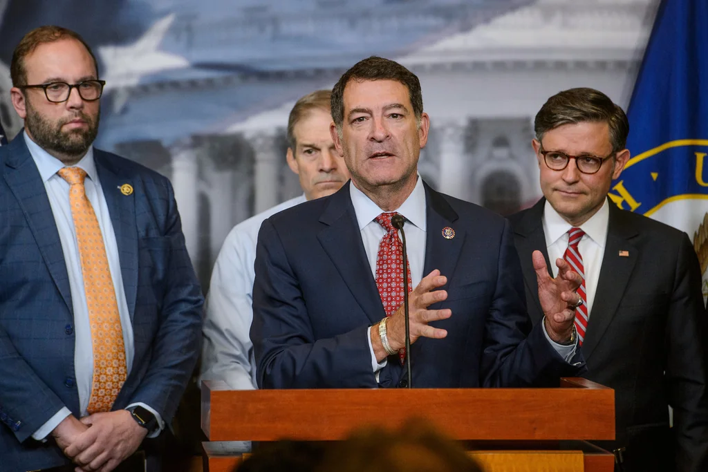 Rep. Mark Green (R-TN), center, is joined by, from left: Reps. Jason Smith (R-MO), Jim Jordan (R-OH), and Speaker of the House Mike Johnson (R-LA), right, during a news conference at the Capitol, Tuesday, May 20, 2025, in Washington. (AP Photo/Rod Lamkey, Jr.)
