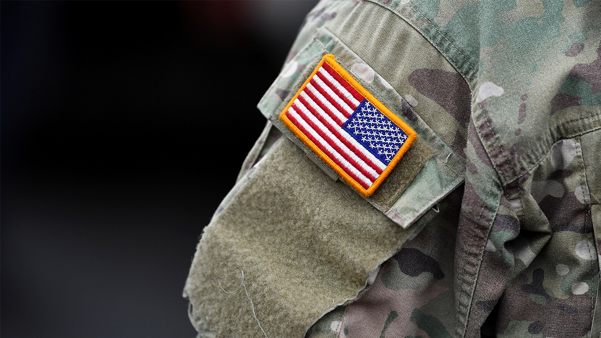 U.S. flag is pictured on the arm of a soldier
