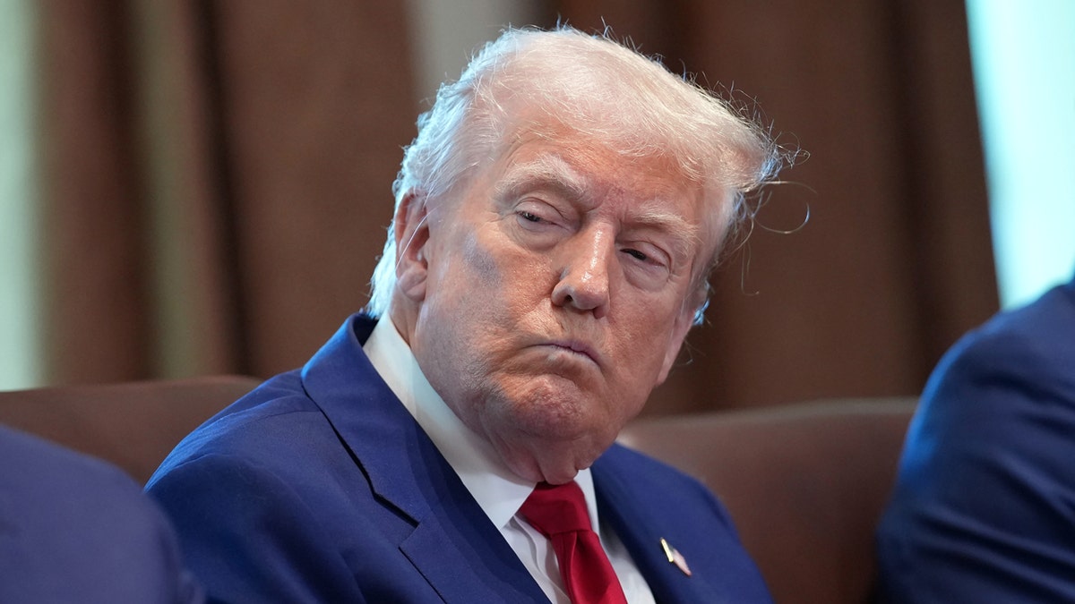 President Trump pursing his lips