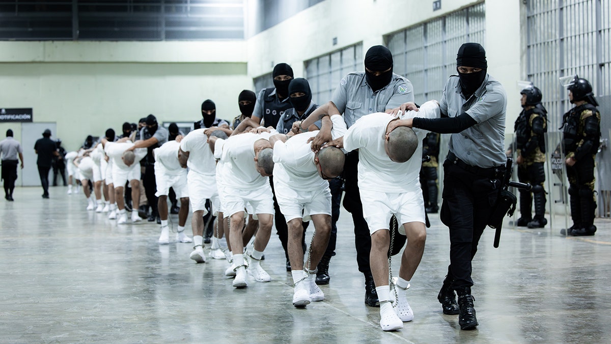 El Salvador guards with inmates