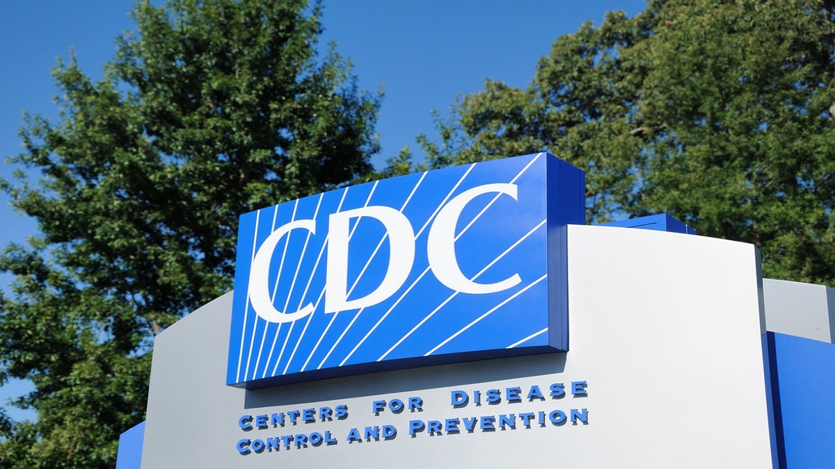 CDC sign, blue sky trees behind it