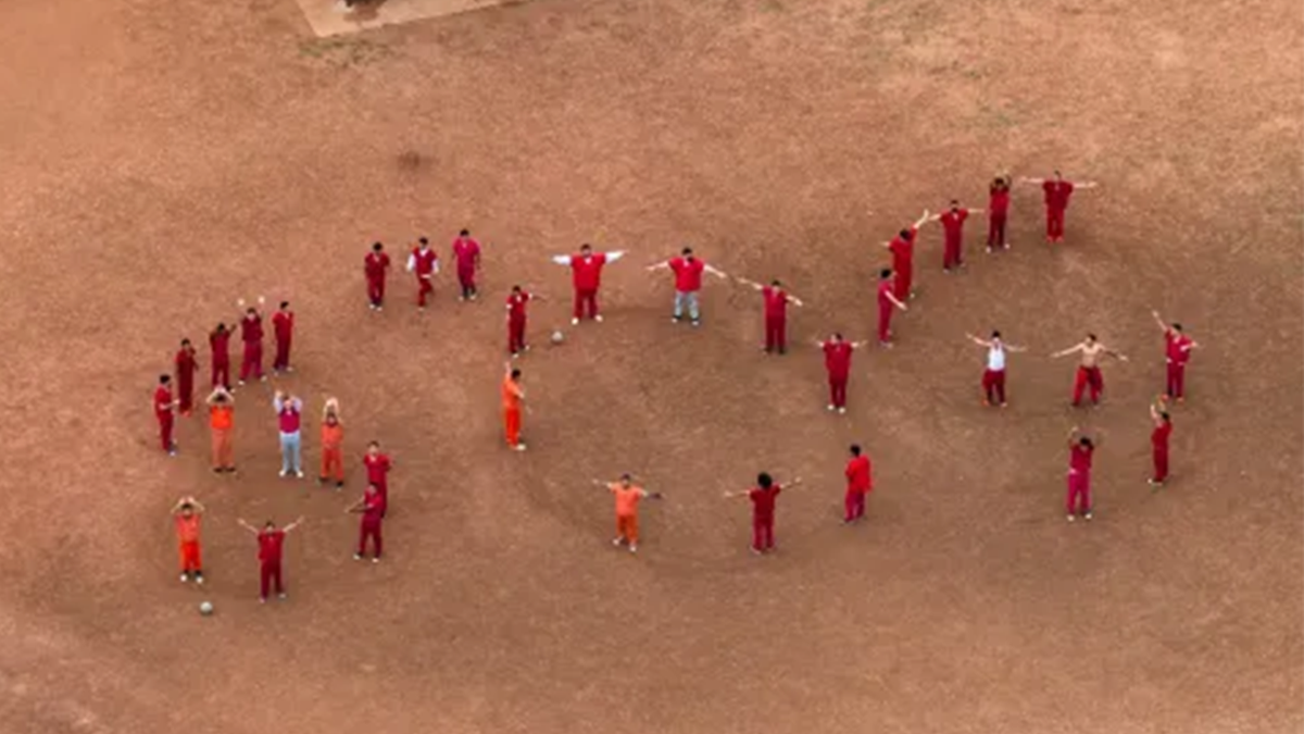 the suspect gang members making an SOS message at a detention facility in Texas