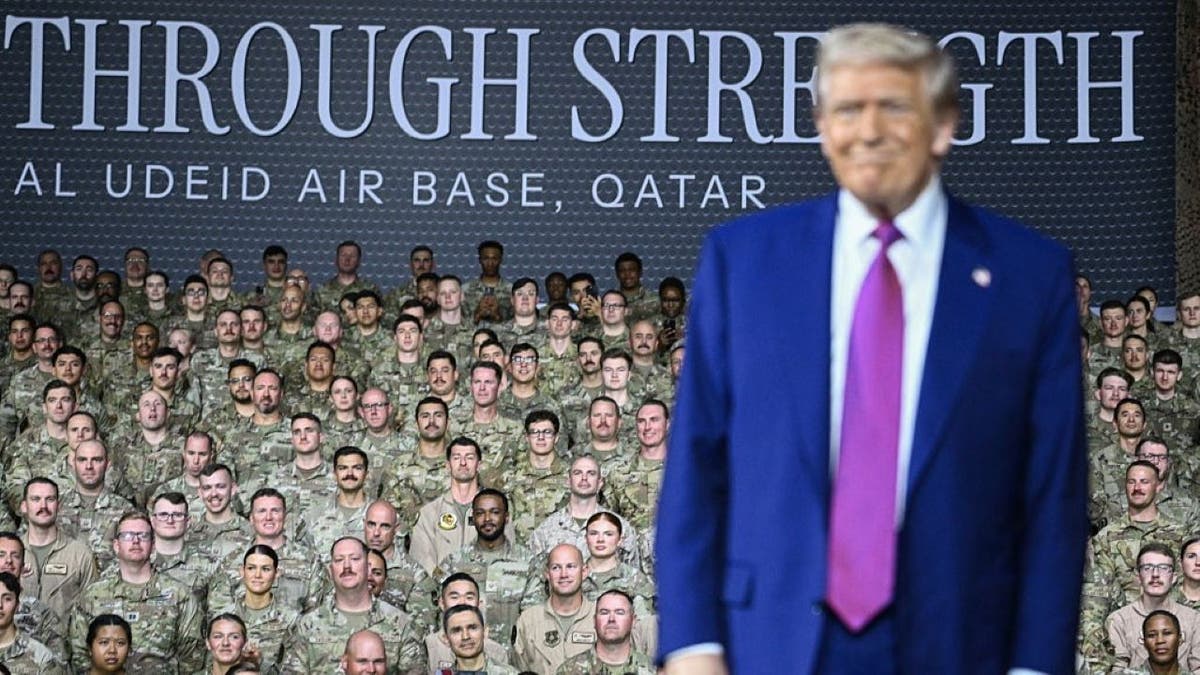 US President Donald Trump arrives to address troops at the Al-Udeid air base southwest of Doha on May 15, 2025. (Photo by Brendan SMIALOWSKI / AFP) (Photo by BRENDAN SMIALOWSKI/AFP via Getty Images)