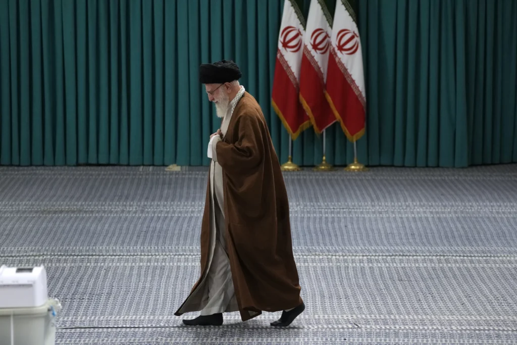 Iranian Supreme Leader Ayatollah Ali Khamenei arrives to vote for the parliamentary runoff elections, in Tehran, Iran, Friday, May 10, 2024.