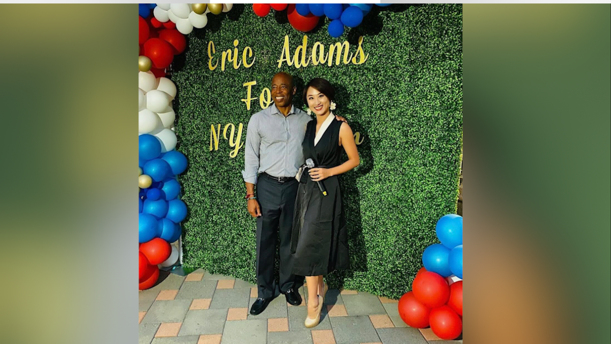 Linda Wang alongside Eric Adams