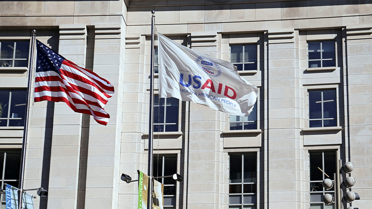 US and USAID flags outside agency hq